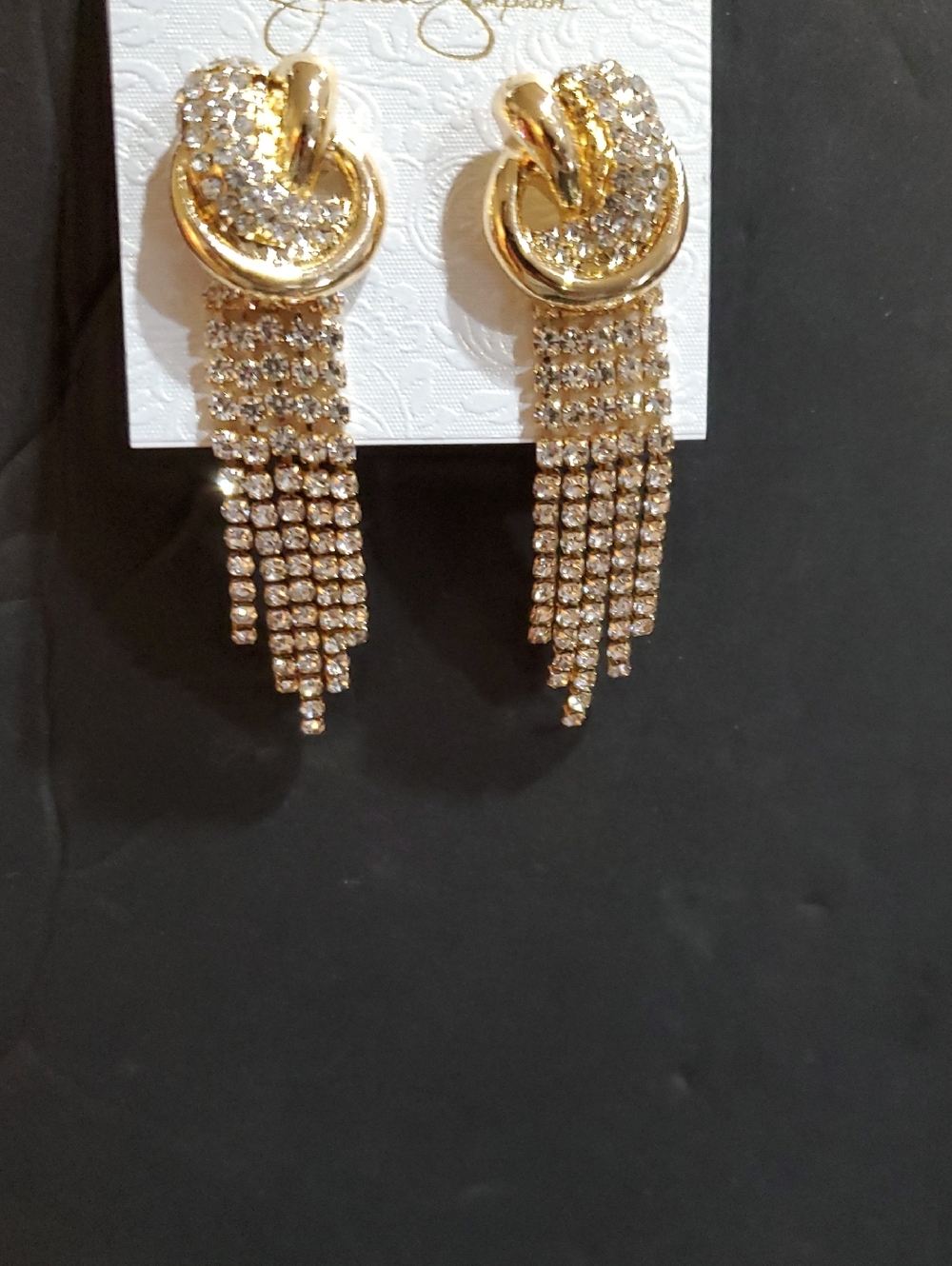 Jessica Simpson gold tone crystal pave knotted rhinestone tassel dangle earrings
